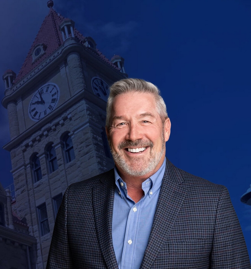 Councillor Dan McLean standing in front of Calgary City Hall clock tower